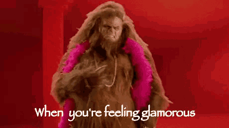 a bigfoot wearing a pink boa and a necklace says when you 're feeling glamorous .