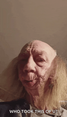 a close up of a person 's face with the words who took this of u