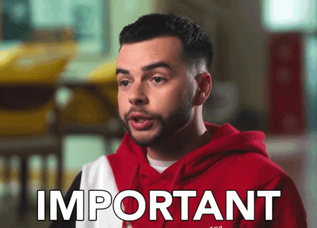 a man in a red hoodie says important in white letters
