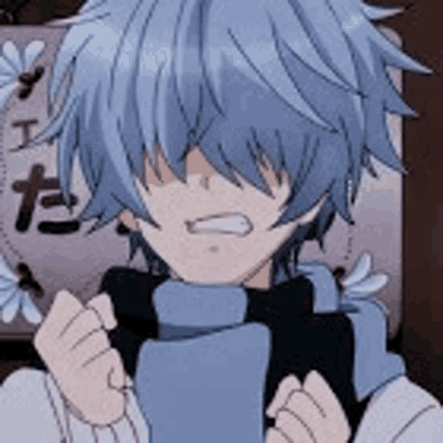 a boy with blue hair and a scarf around his neck is sitting in front of a wall .