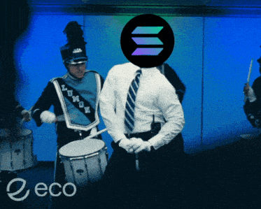 a man in a suit is playing drums in a marching band with a logo for eco in the corner