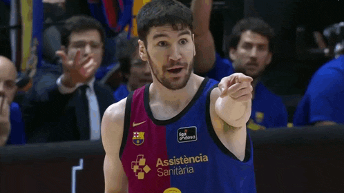 a man wearing a basketball jersey that says assistance sanitaria