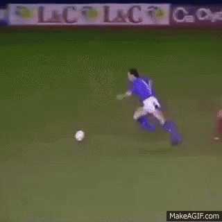 a group of soccer players are playing on a field with an ad for cosmos in the background .