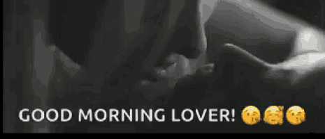 a black and white photo of a man and woman kissing with the words `` good morning lover '' written above them .