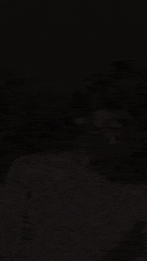 a blurry picture of a man 's face with a shadow on his face