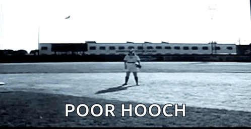 a black and white photo of a baseball player on a field with the words `` poor hooch '' below him .
