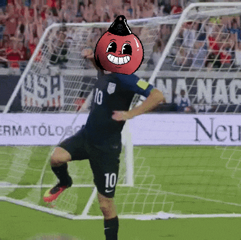 a soccer player with a cartoon face on his head has the number 10 on his shorts