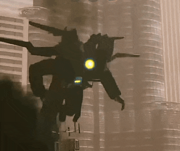 a robot with a yellow light on its head is flying in front of a building .