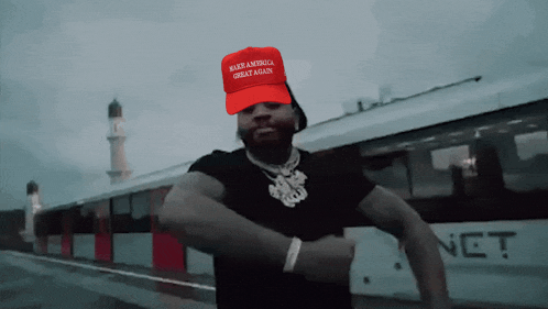 a man wearing a make america great again hat