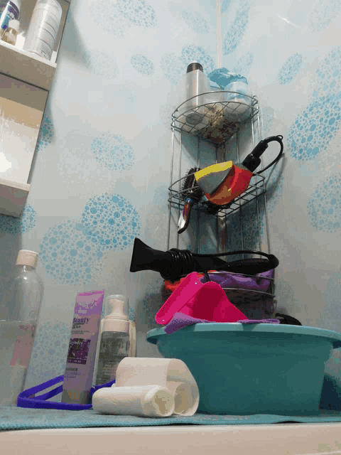 a bathroom with a bottle of aqua 's lavender shampoo on the counter