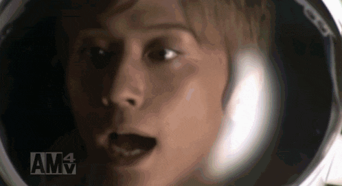 a close up of a person 's face with the letters amv in the corner