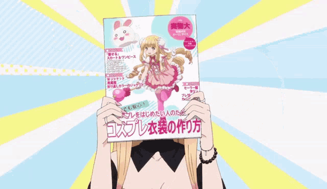 a girl is holding up a magazine with a bunny on it