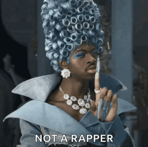 a woman in a blue wig says not a rapper in the corner