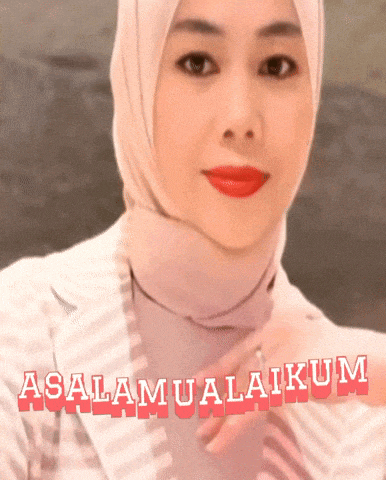 a woman wearing a hijab and a striped jacket says assalamualaikum