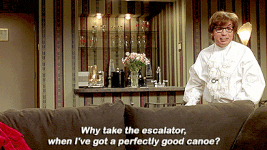 a man sitting on a couch with the words why take the escalator