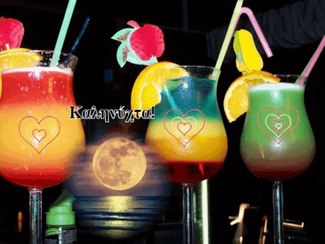 four glasses of different colored drinks with straws and hearts on them and the words καληνυχτα on the bottom