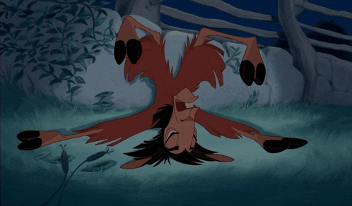 a cartoon character laying on its back in the grass