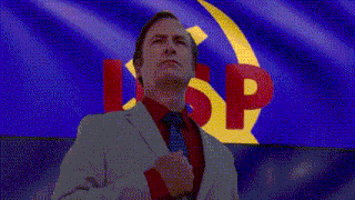a man in a suit and tie stands in front of a flag with the letter sp on it