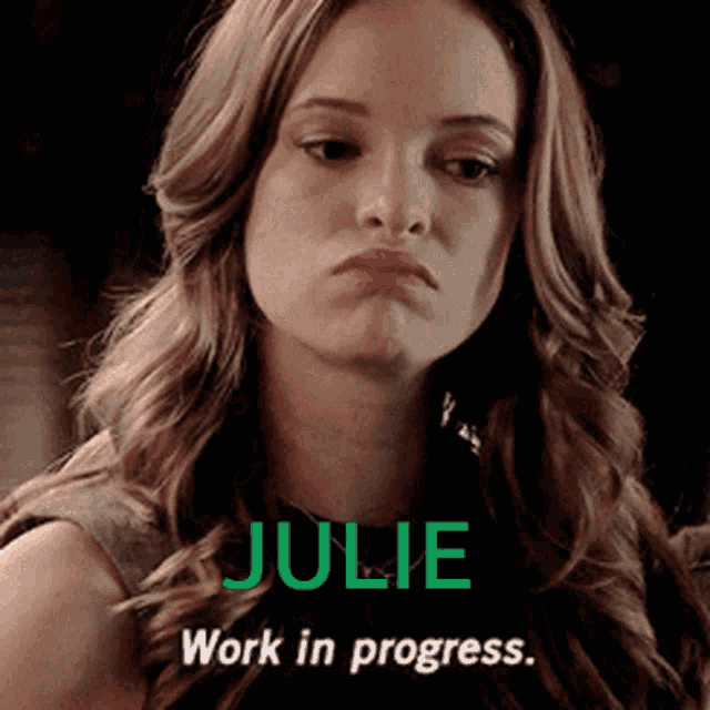 a woman with julie work in progress written in green