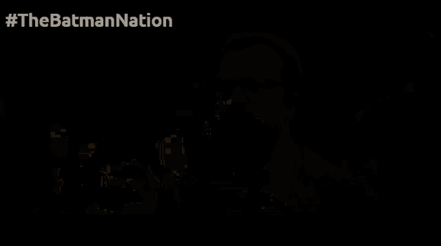 a gray background with the words #thebatmannation on the bottom