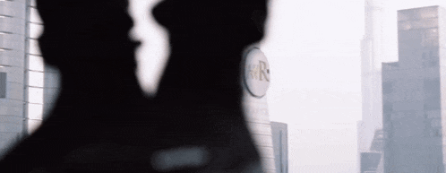 a silhouette of a person standing in front of a sign that says rr