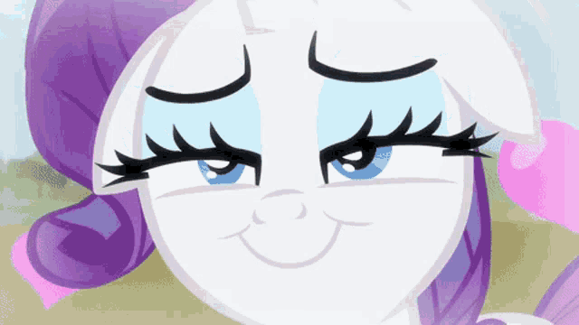 a close up of a pony 's face with blue eyes