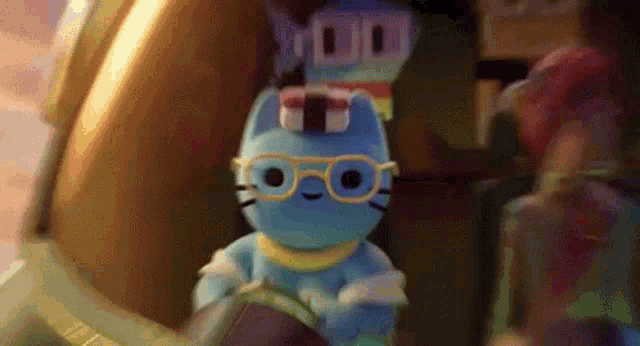 a blue stuffed animal with glasses and a sushi hat