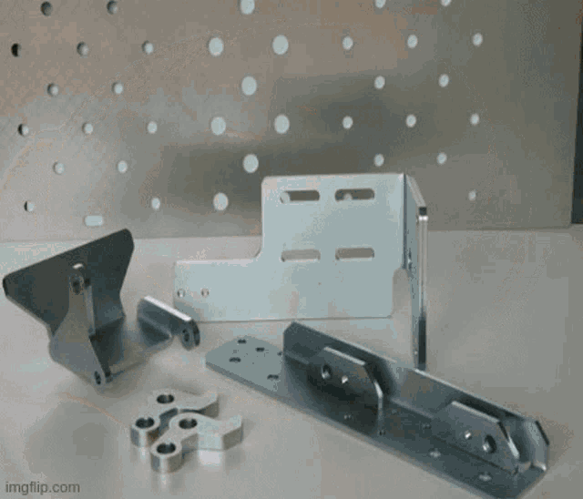 a bunch of different types of plastic screws are laying on a table