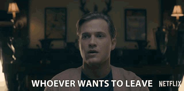 a man in a living room with the words whoever wants to leave netflix below him