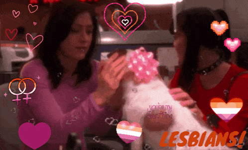 a couple of women holding a dog with the words lesbians in the corner