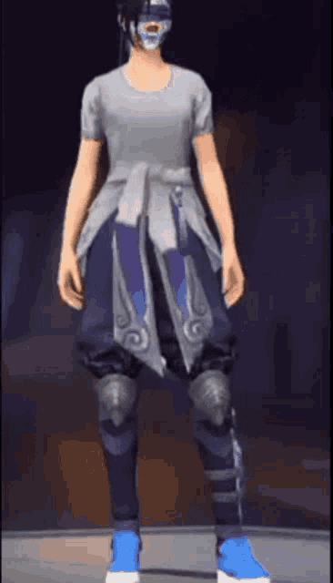 a person wearing a mask and blue pants is standing on a stage .