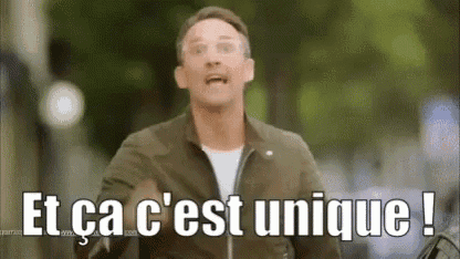 a man is walking down a street with the words `` et ca c 'est unique ! ''