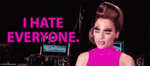 a drag queen is making a funny face and saying i hate everyone .