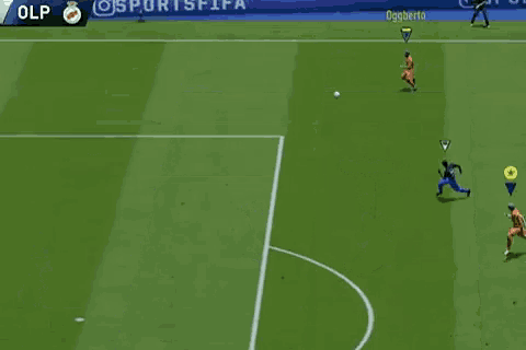 a soccer game is being played on a soccer field with a goalie and two players on the field .