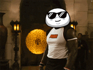 a man wearing sunglasses and a white puma shirt