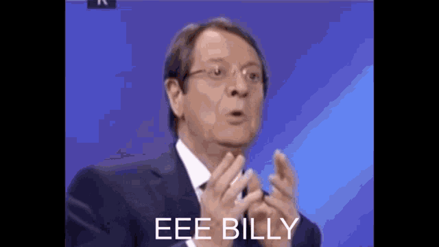 a man in a suit says eee billy