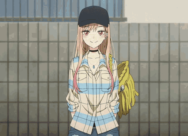 a girl wearing a plaid shirt and a black hat is holding a baseball mitt