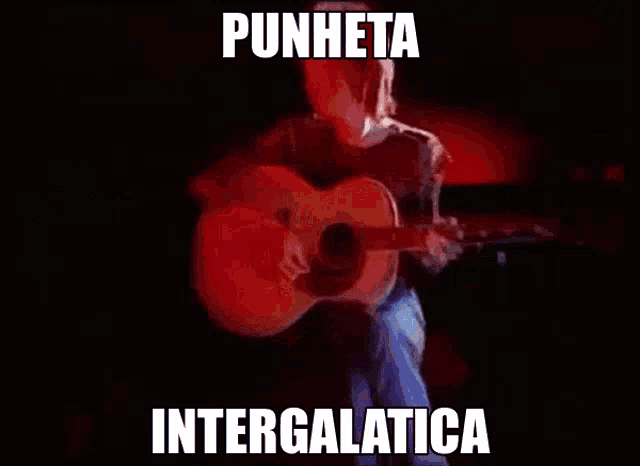 a person is playing an acoustic guitar with punheta intergalatica written on the bottom
