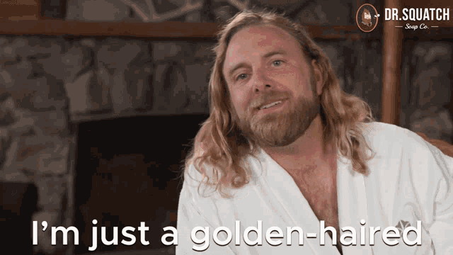 a man with long blonde hair and a beard says " i 'm just a golden-haired "