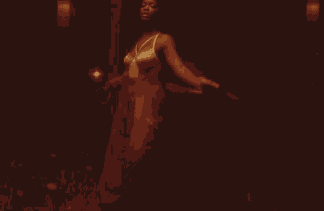 a woman in a dress is dancing in a room