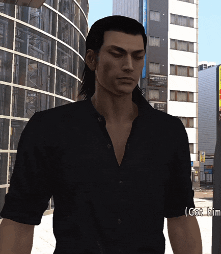 a man in a black shirt is standing in front of a building that says got him on it