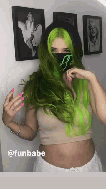 a woman with green hair is wearing a mask and has the hashtag funbabe