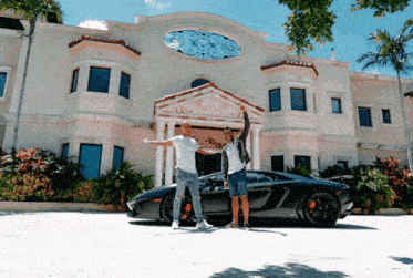 two men standing in front of a large house with a car