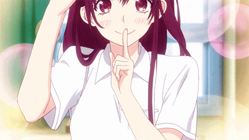 a girl in a white shirt is holding her finger to her lips