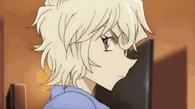 a close up of a person 's face with blonde hair
