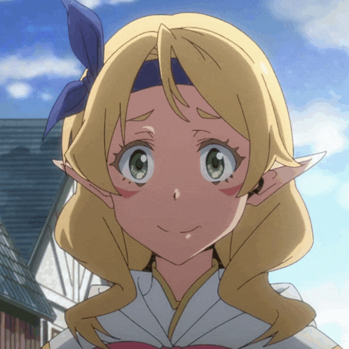 a girl with blonde hair and green eyes is wearing a headband