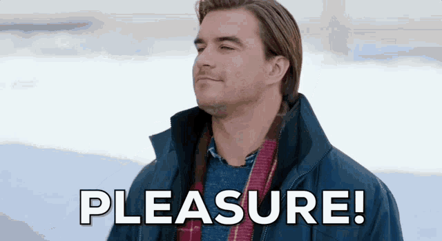 a man in a blue jacket is standing in the snow with the words pleasure written above him .