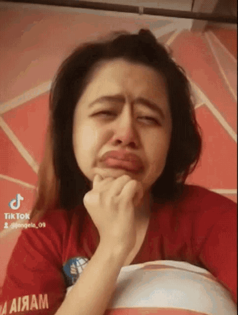 a woman with a red shirt that says aiiam
