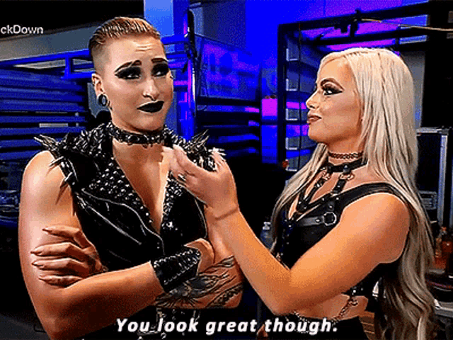 two women are standing next to each other with one saying you look great though