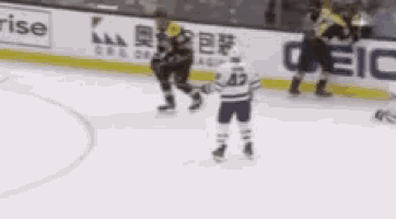 a hockey game is being played in front of a banner that says surprise